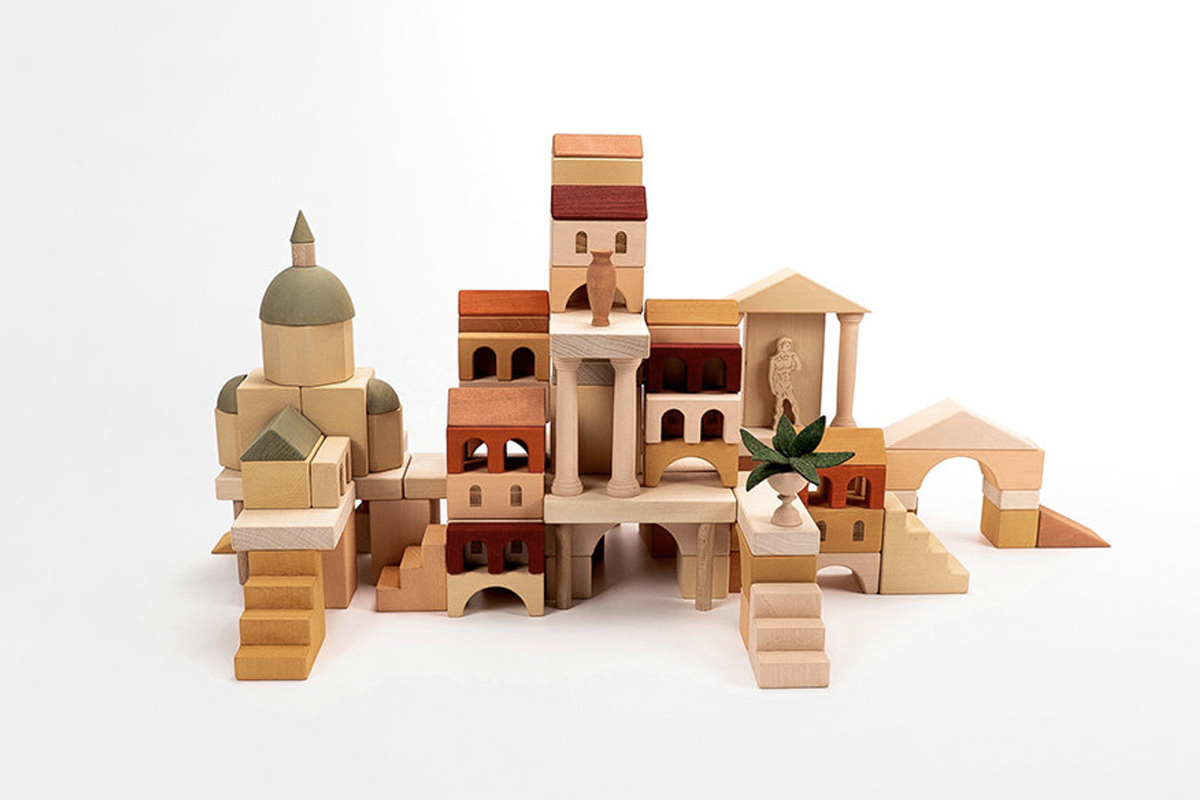 Wooden blocks from Ukranian toy maker Sabo Concept featurng clean lines, thoughtful color choices, and minimal designs that encourage creativity and imagination. Shaped as an Italian Ancient City. 