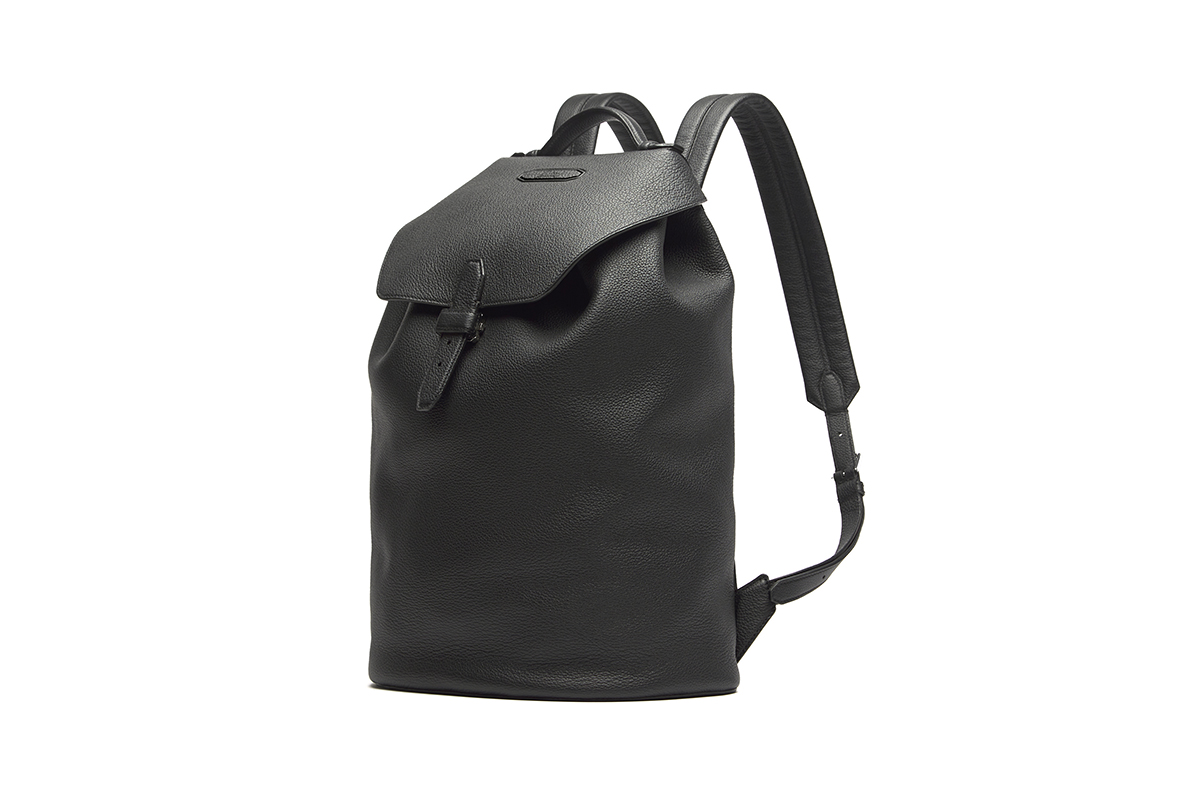 A scratch-free grained rodos leather backpack from Brioni treated to ensure beautiful aging and crafted in Italy, is a lasting versatile accessory.